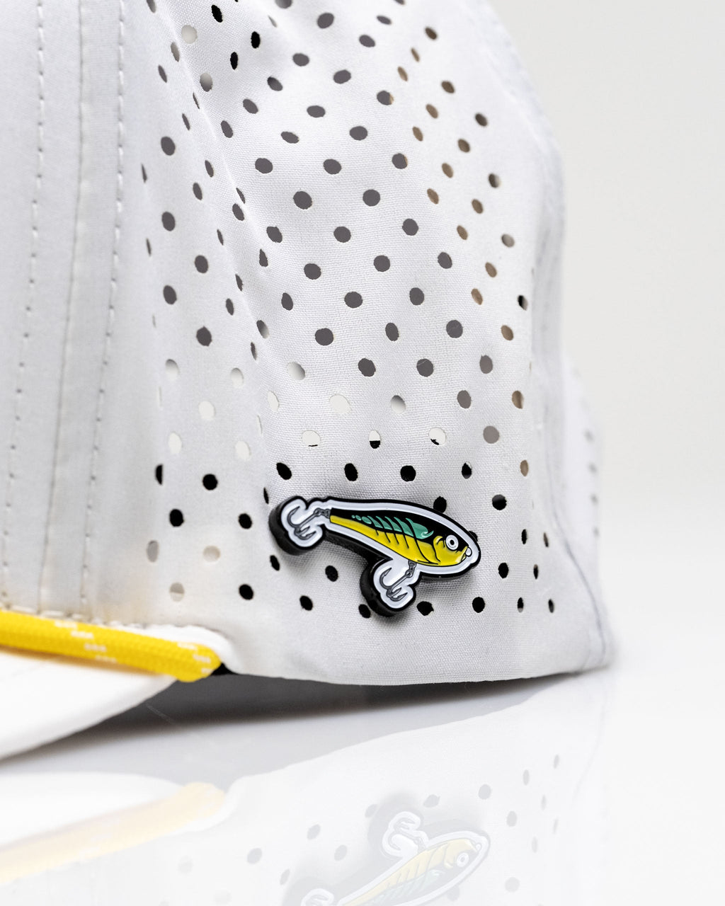 Pins & Aces Fishing Lure Perforated Rope Golf Hat – White